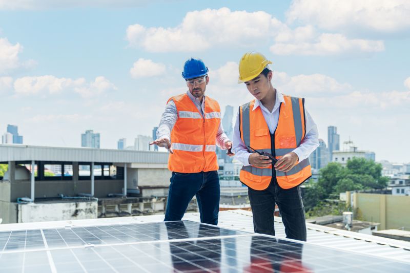 Technician Installing Solar Panels